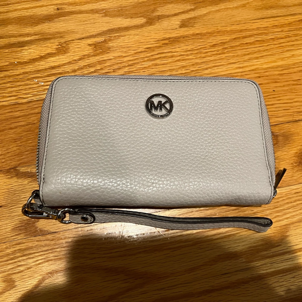 Michael Kors wristlet with detachable strap.